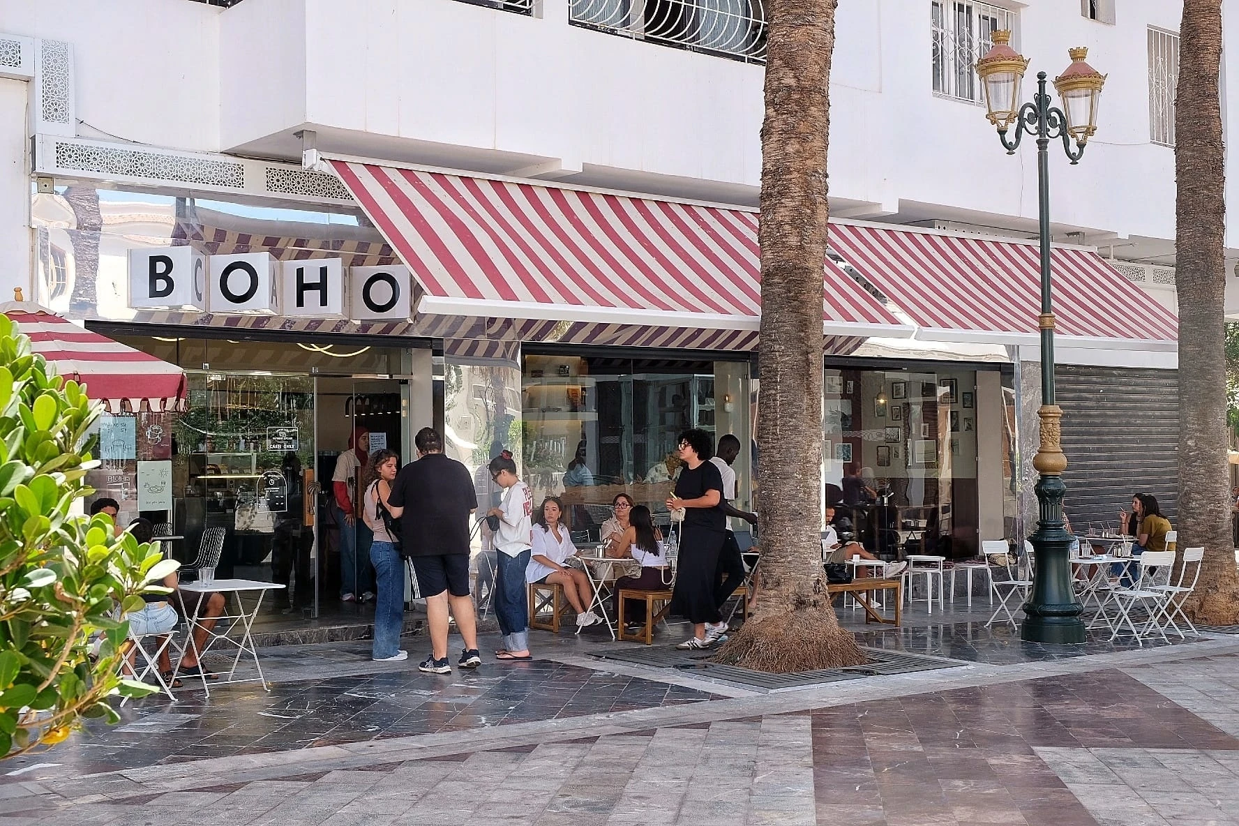 People hanging around outside Boho Cafe in Rabat