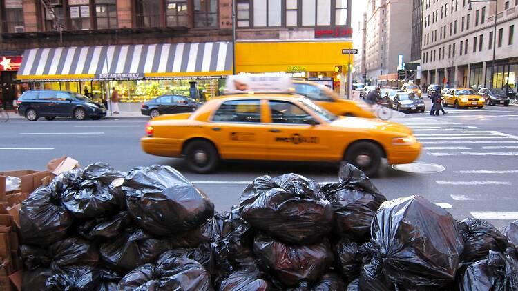 Black plastic bags full of trash on a New York street
