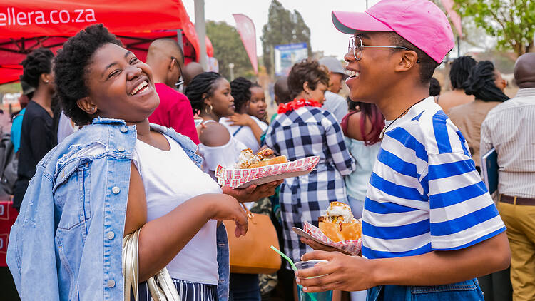 People at an outdoor food festival Diverse African people at a bread based street food outdoor festival