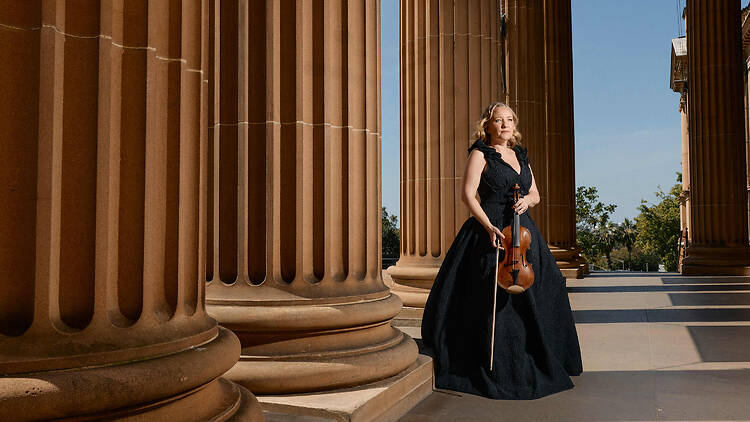 woman in black gown with violin