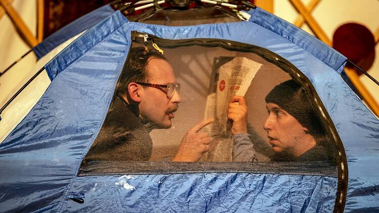 We Come From Far, Far Away two men inside a blue tent