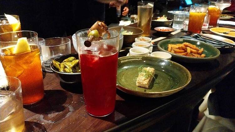 Two of my favourite drinks, Gojira and Bloody Heron, with prawn toast and fries at Selva