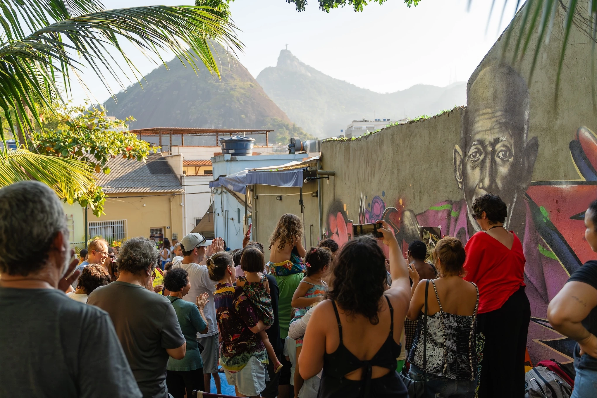 A treet party in Laranjeiras, Rio de Janeiro, with Christ the Redeemer visible ahead
