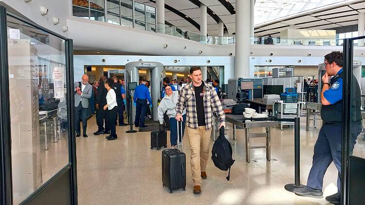 Passengers leave TSA security inside New Orleans Airport Passengers leave TSA security inside New Orleans Airport
