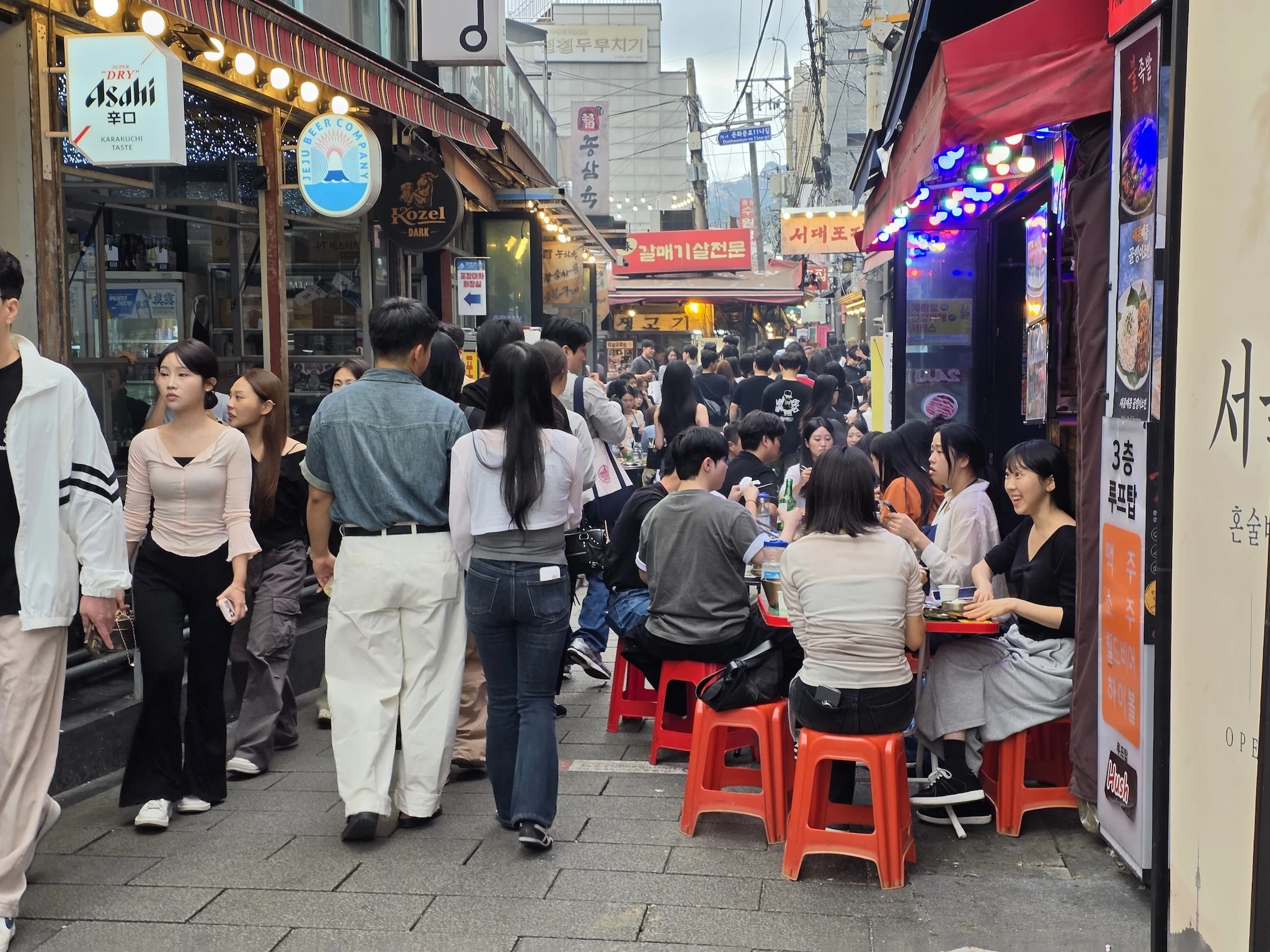 People eat and hang out in the lanes of Jongno 3-ga, Seoul