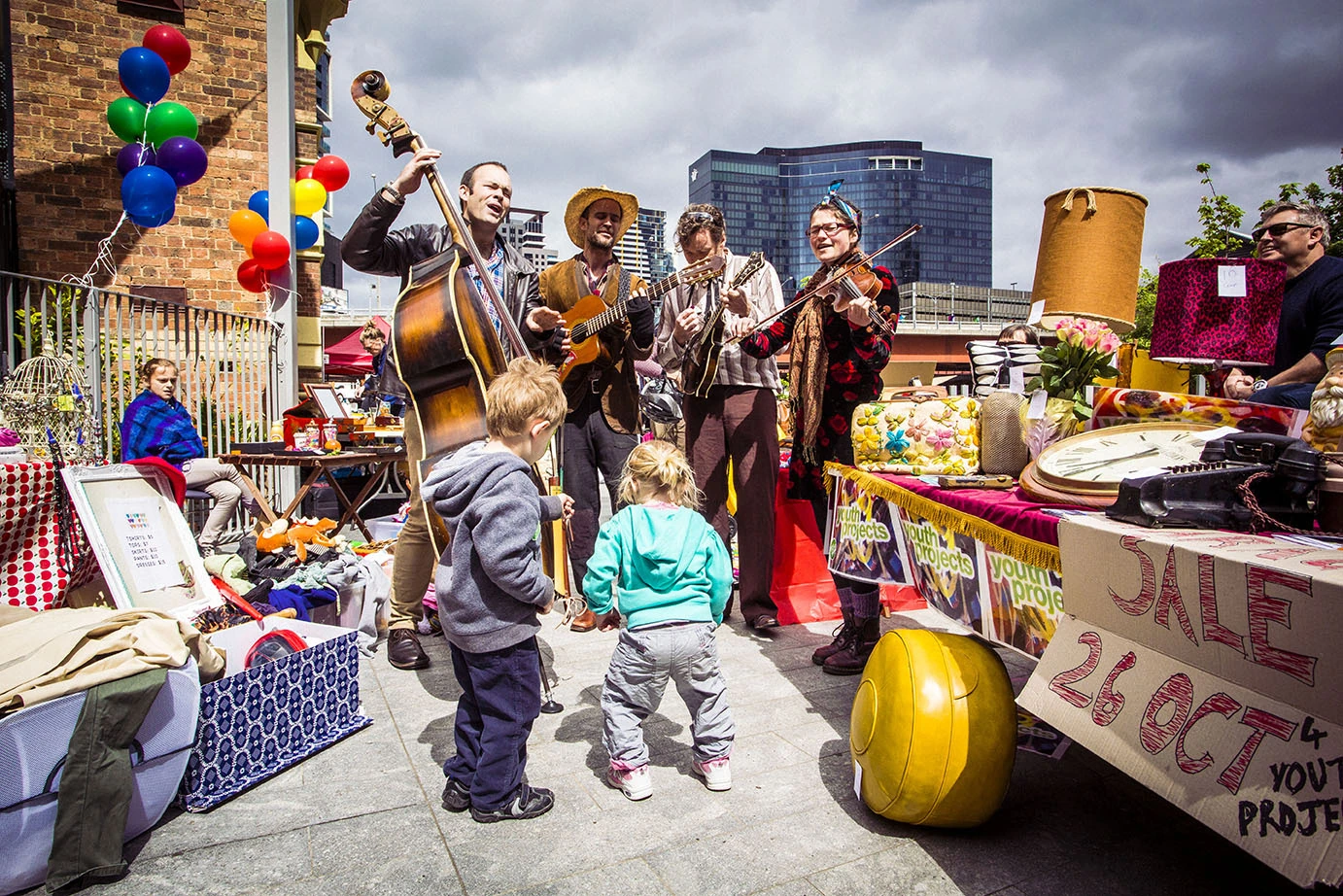 Outdoor garage sale with musicians