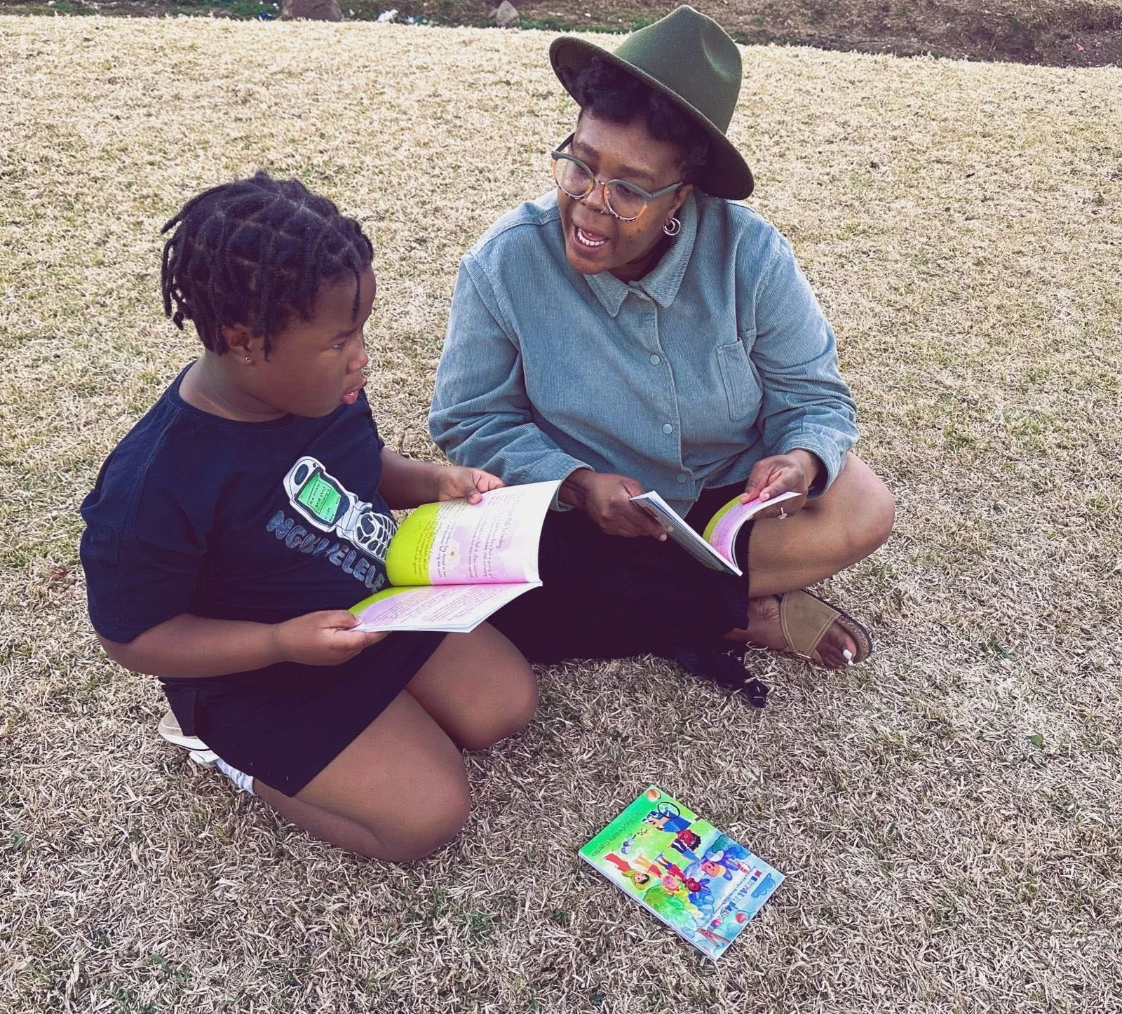Rephethile helping a young reader discover new worlds...and words.