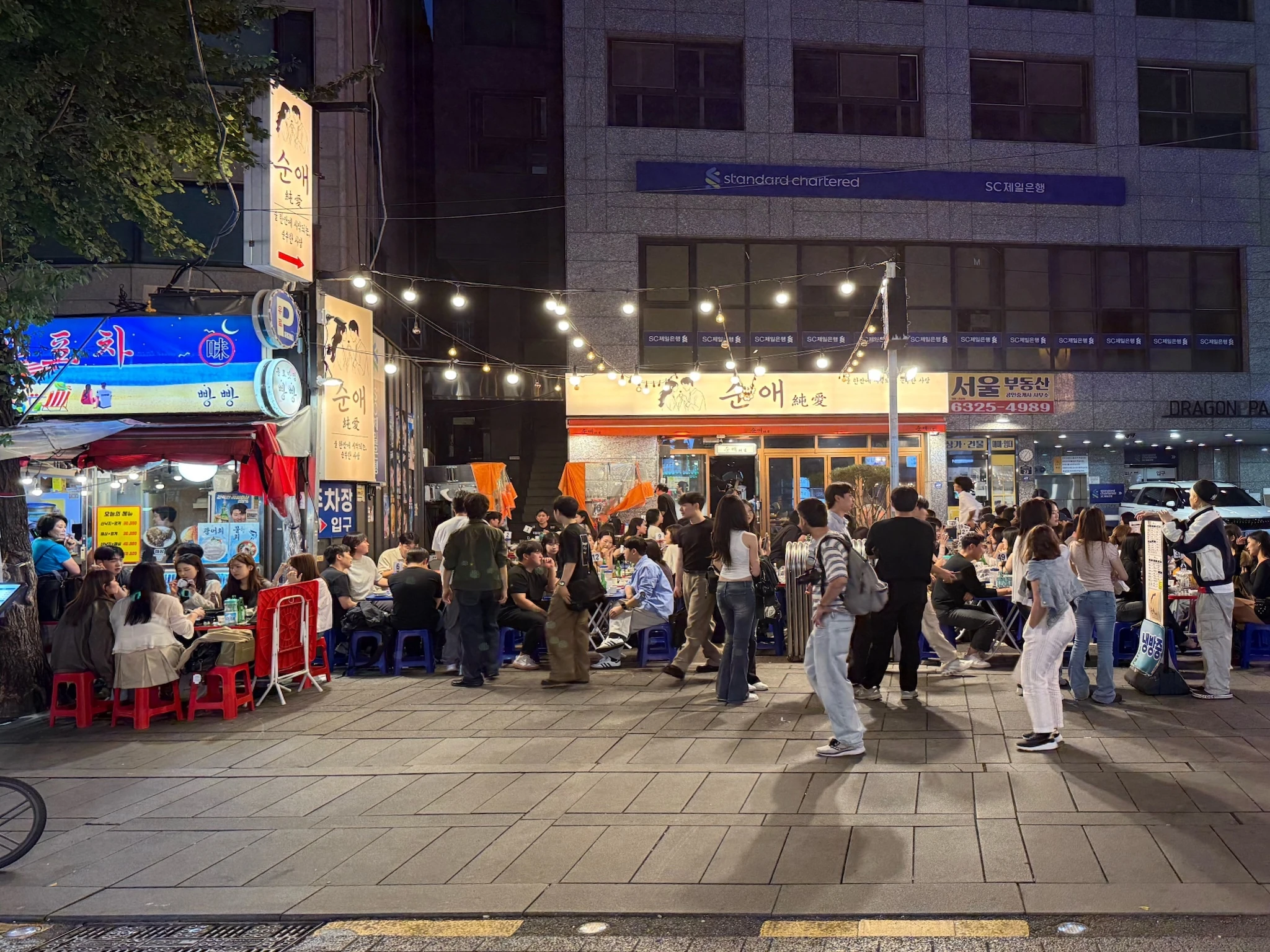 Local gathered to eat at the pochas (late-night food stalls) in Jongno 3-ga, Seoul