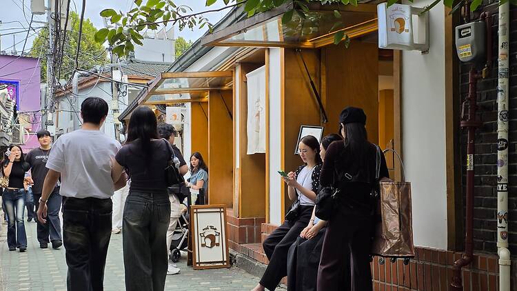 People hanging out outside Mil Toast bakery in Jongno 3-ga in Seoul