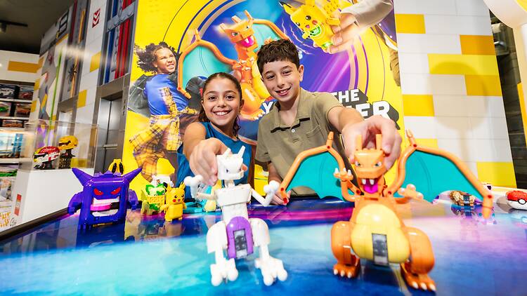 Kids at the LEGO® Pokémon™ SMART Play™ experience available in-store