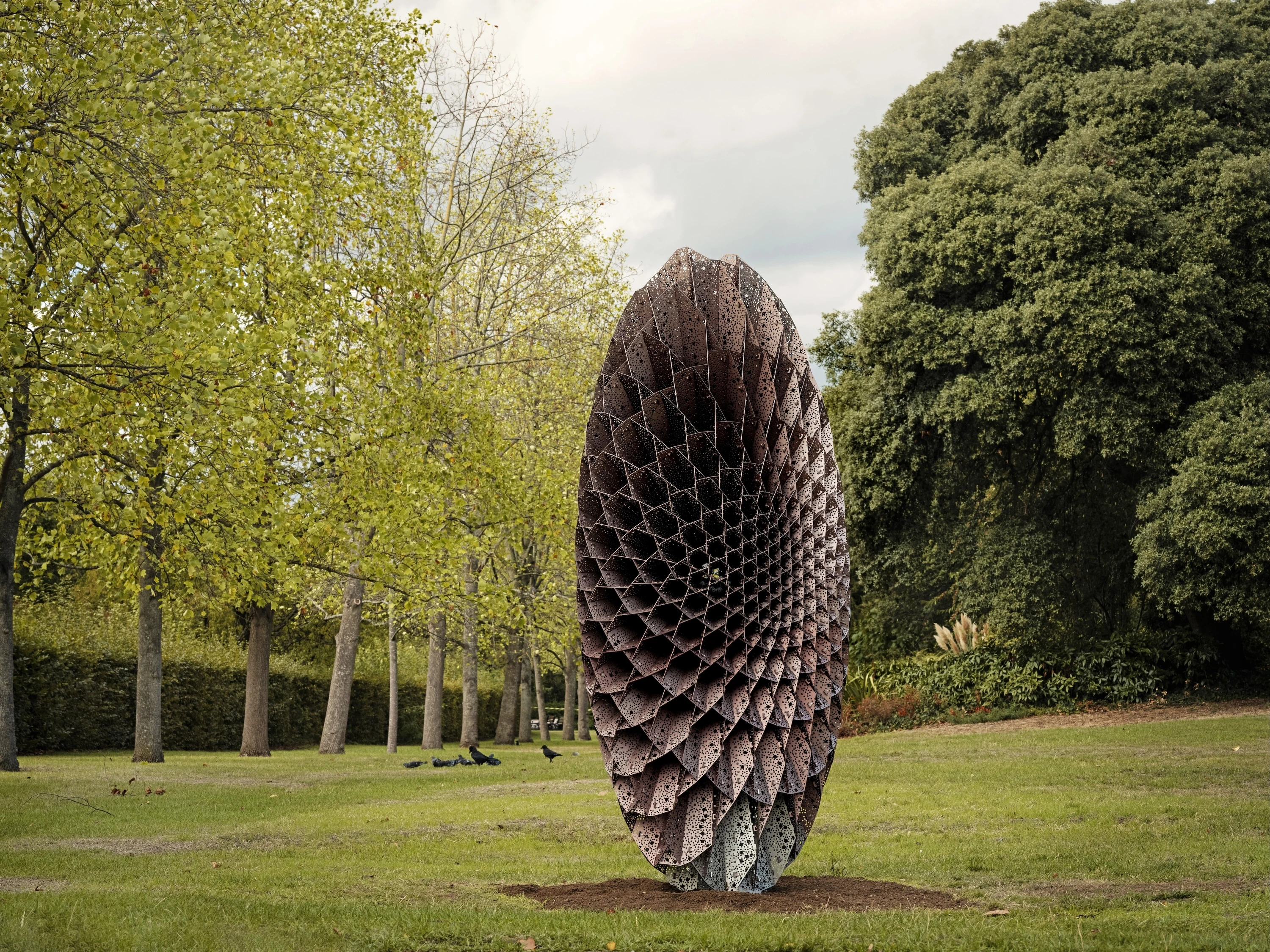 Elliptical sculpture made of perforated anodised aluminium in Regent's Park