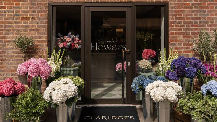 Buckets of colourful flowers outside the Claridge’s Flower Shop