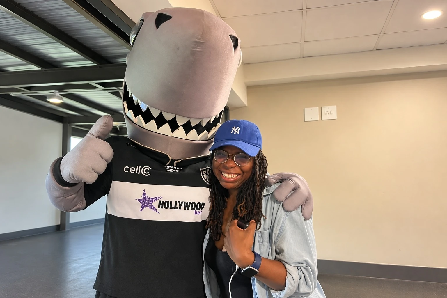 Time Out Durban City Editor Nobuhle Modise meets the Sharks mascot at Princess Magogo Stadium.