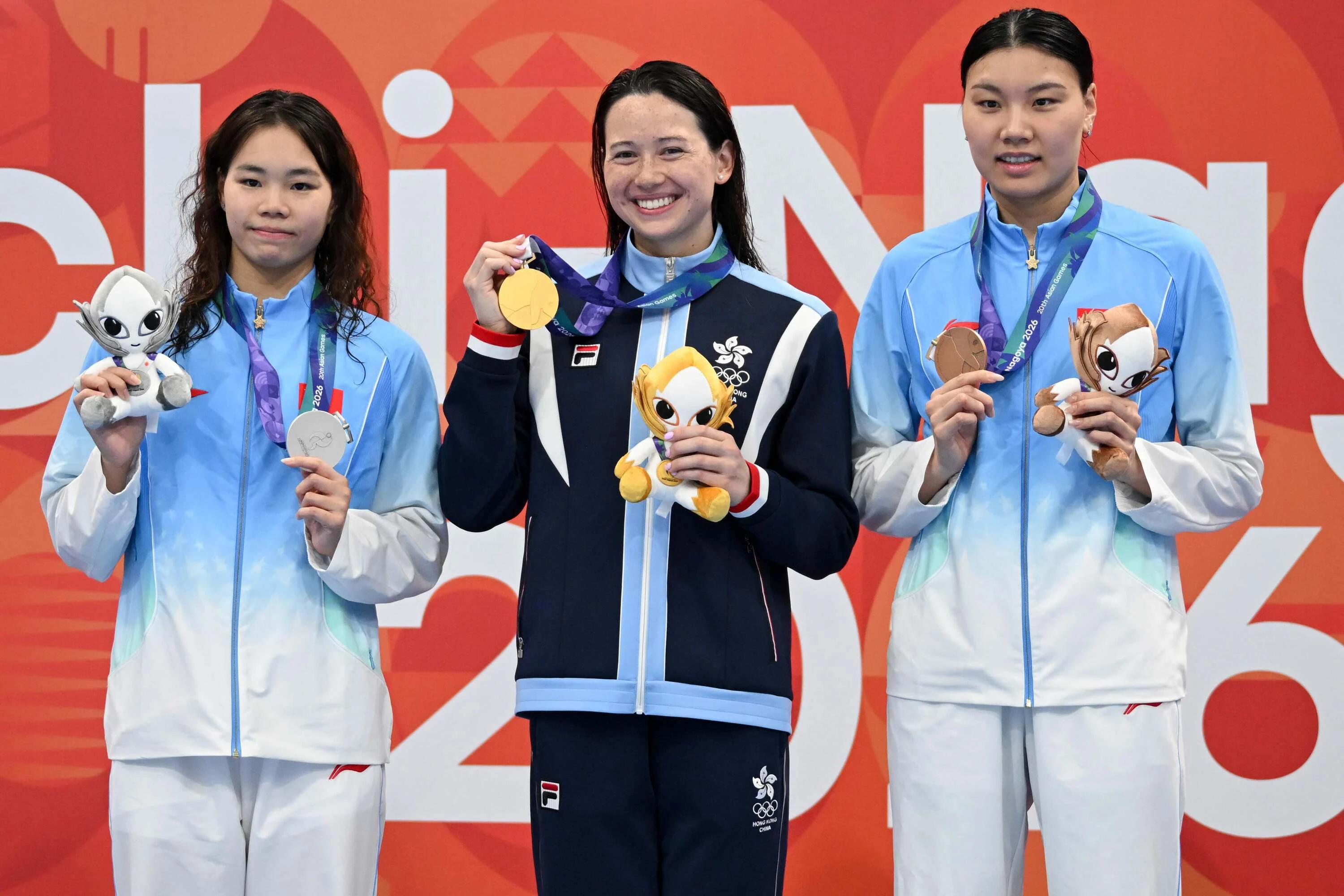 Siobhan Bernadette Haughey at the victory ceremony of the women's 200m freestyle swimming event during the 2026 Asian Games