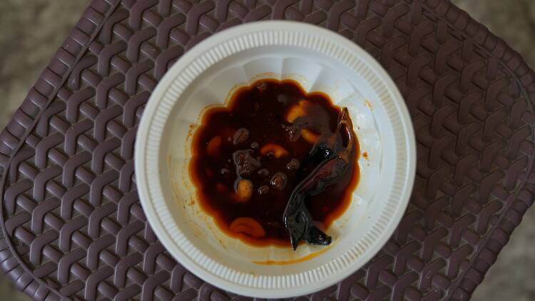 Tasting fresh pickle at Qadeem Achar Ghar