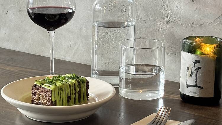 A dish with a glass of red wine at Table at 464 A dish with a glass of red wine at Table at 464