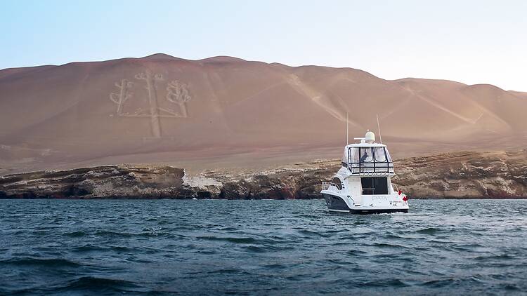 A boat overlooking ancient hieroglyphics