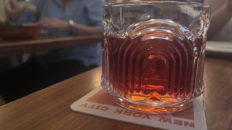 Negroni on a coaster that reads New York
