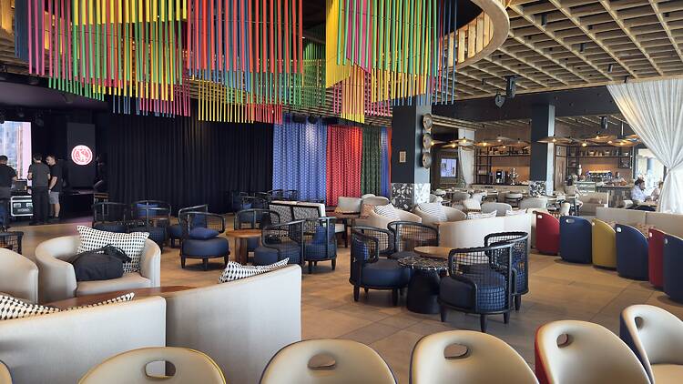 Colourful overhead details bring the resort’s main bar and lounge to life.
