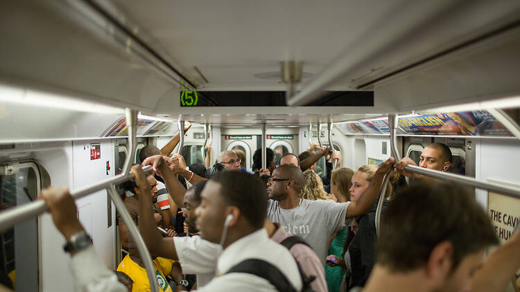 Passengers on a crowded subway train