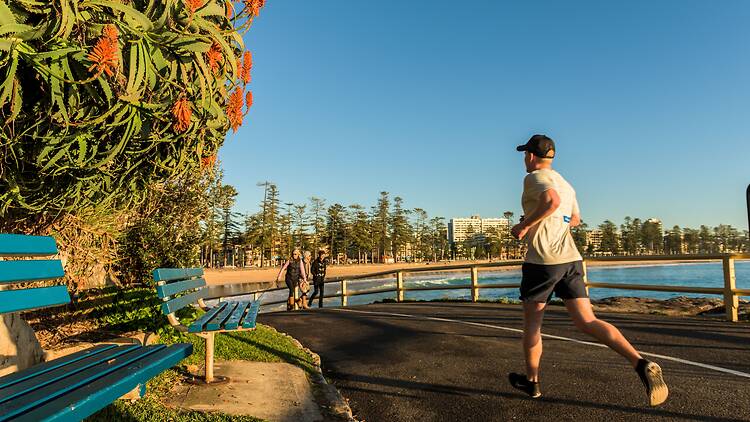 Manly, Sydney Man jogging by Manly Beach