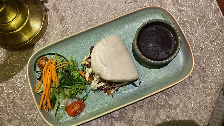 Beef Bao: fillet steak in a steamed bao with sesame cabbage slaw, jalapeños, Japanese aioli and roasted garlic jus.