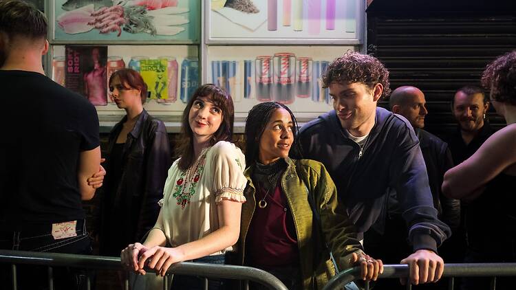It Gets Worse by A24 a screengrab from "It Gets Worse" by A24 depicting three of the show's stars waiting in line