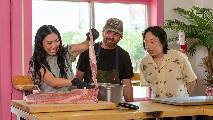 “Awkwafina: The Unlikely Cook” premieres on Friday, November 6 on Apple TV. Awkwafina making a face as she touches raw meat on “Awkwafina: The Unlikely Cook”