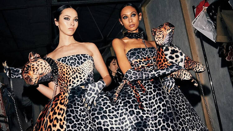 Melbourne Fashion Week Two models conjoined through one leopard print dress.
