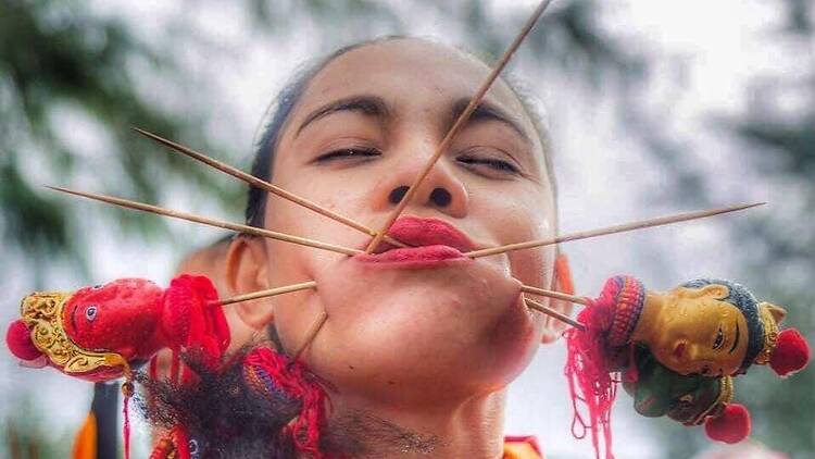 Meet the Phuket spirit medium who walks through fire and pierces her face