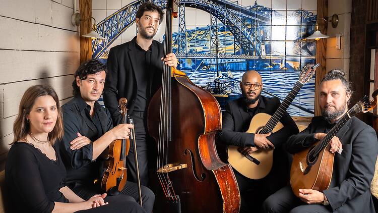 A band sat against a tiled back drop