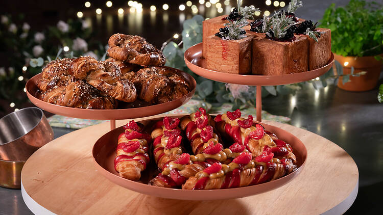 A trio of baked goods A trio of baked goods on three wooden stands