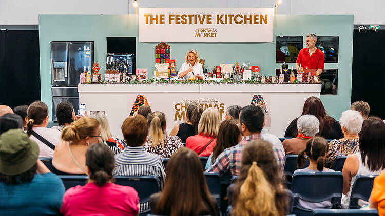 The Festive Kitchen audience look to chef on stage