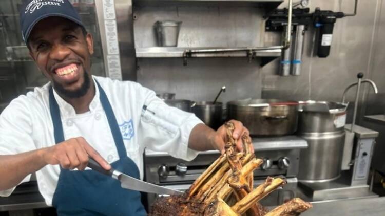 Chef Nelson Makgakoa preparing meat in the kitchen Chef Nelson Makgakoa preparing meat in the kitchen