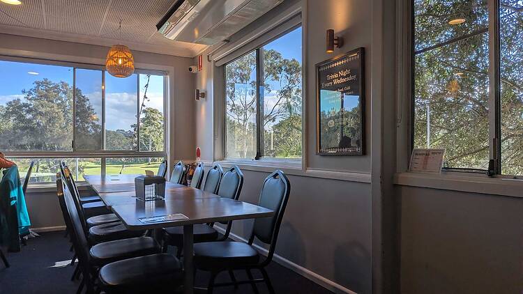 A table with trees outside the window