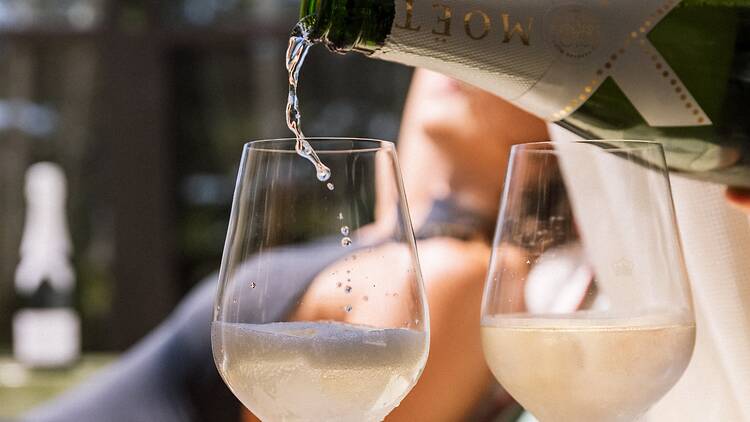 A bottle of Moet Ice x Pharrell Williams A bottle of Moet Ice x Pharrell Williams being poured