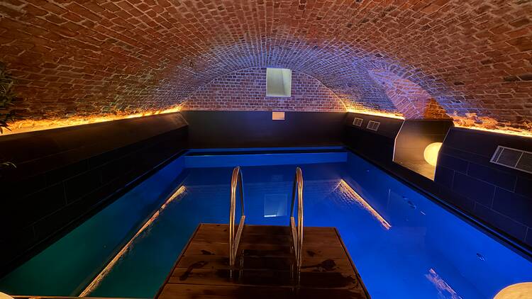 Hidden Basement Pool at Hyatt Centric Gamla Stan, Stockholm An illuminated blue indoor pool situated inside an ancient brick-vaulted basement cellar at Hyatt in Stockholm's Old Town.