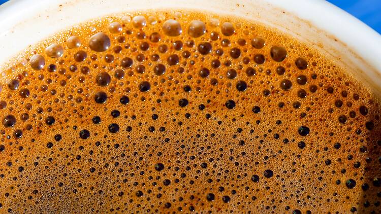 Close-up of coffee froth on a mug