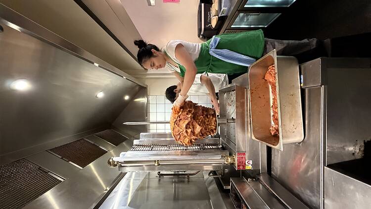 Chefs working in the kitchen at Super Taco