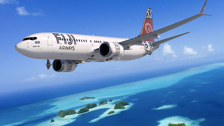 Fiji Airways Plane flying over islands
