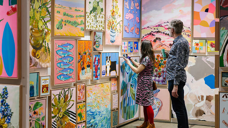 People checking out art at The Affordable Art Fair