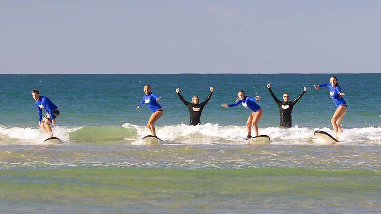Take a surfing lesson Take a surfing lesson