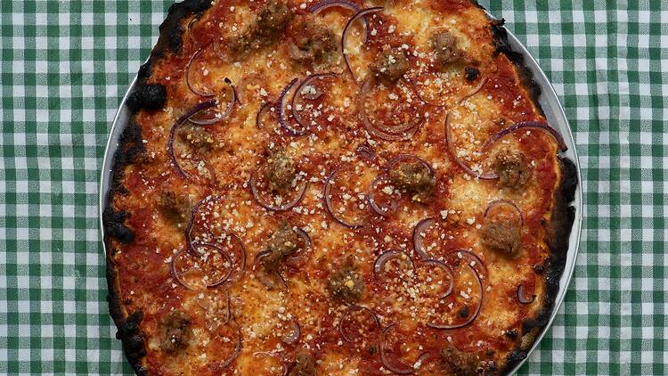 A sausage & onion at Ozzy’s Apizza at Bedford Tavern