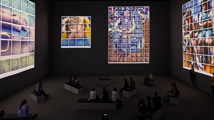David Hockney: Bigger & Closer (not smaller & further away) people watching a large scale digital art installation