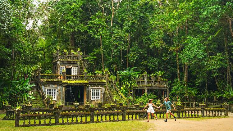 Paronella Park Couple exploring the park set among the lush rainforest