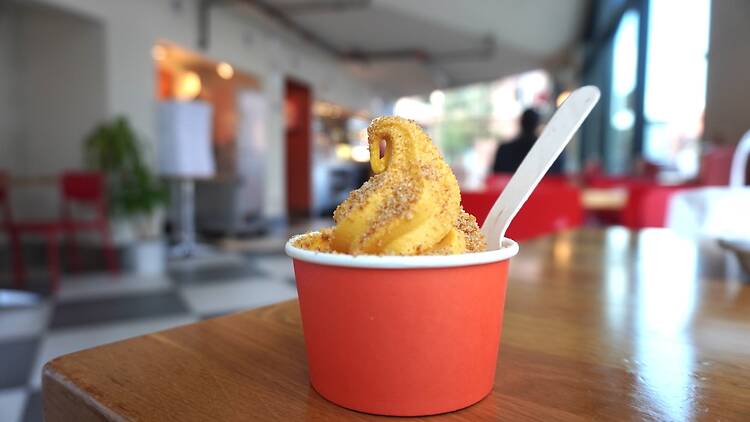 Soft serve ice cream in an orange cup