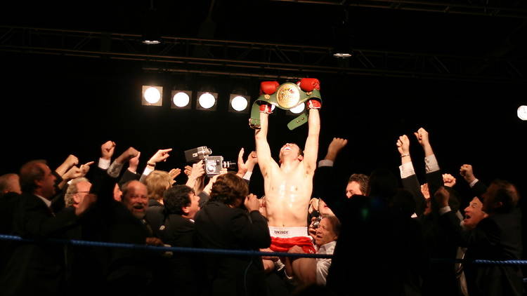 Winstone_lifting_WBC_belt.jpg